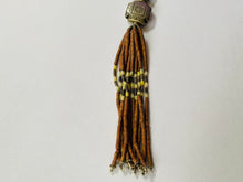 Load image into Gallery viewer, Bolo Beaded Necklace With Carved Tribal Motif
